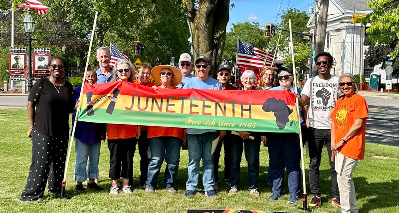 Some BCCR members gather for a Juneteenth flag raising photo.